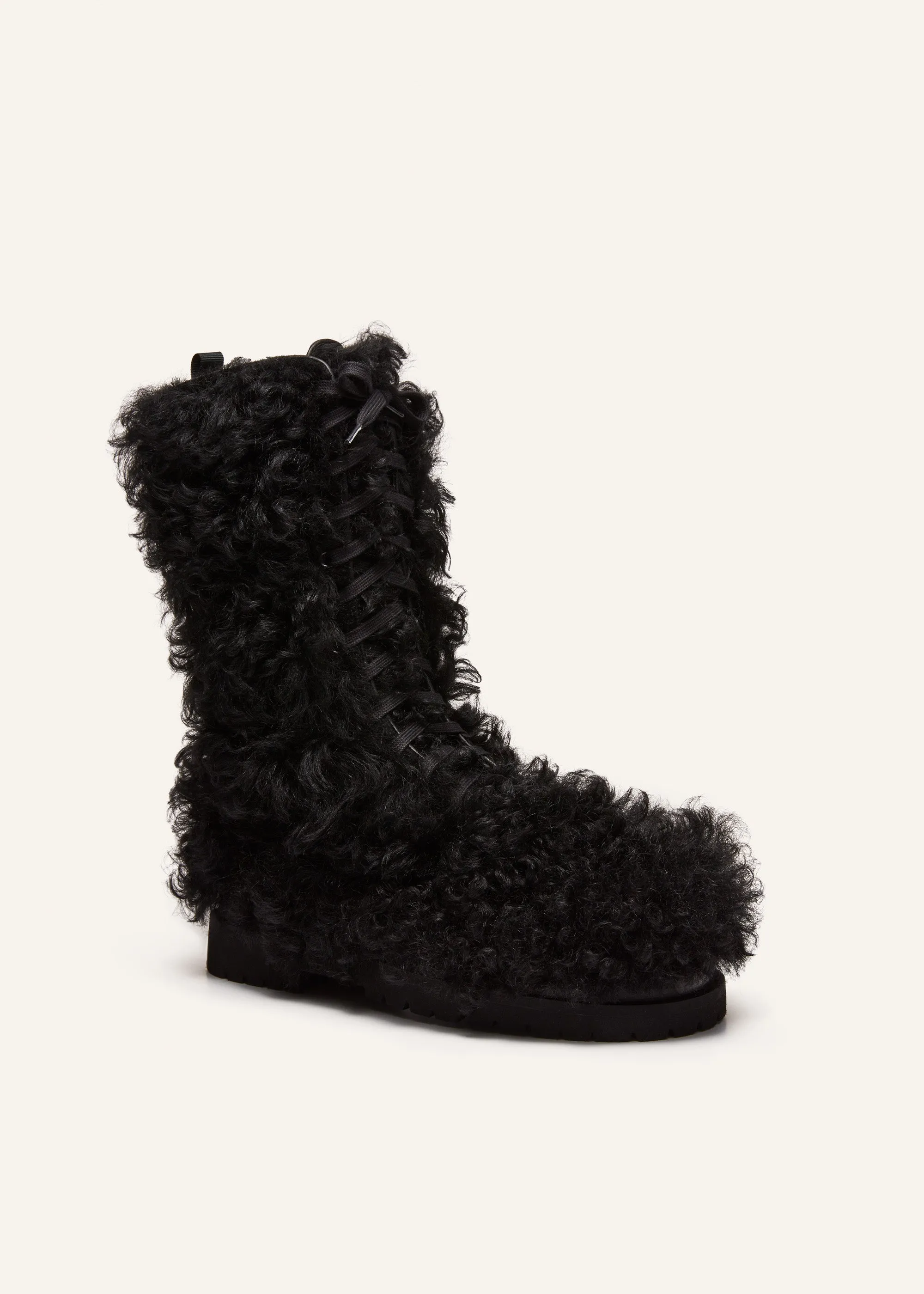 Shearling combat boots in black