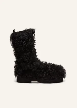 Shearling combat boots in black