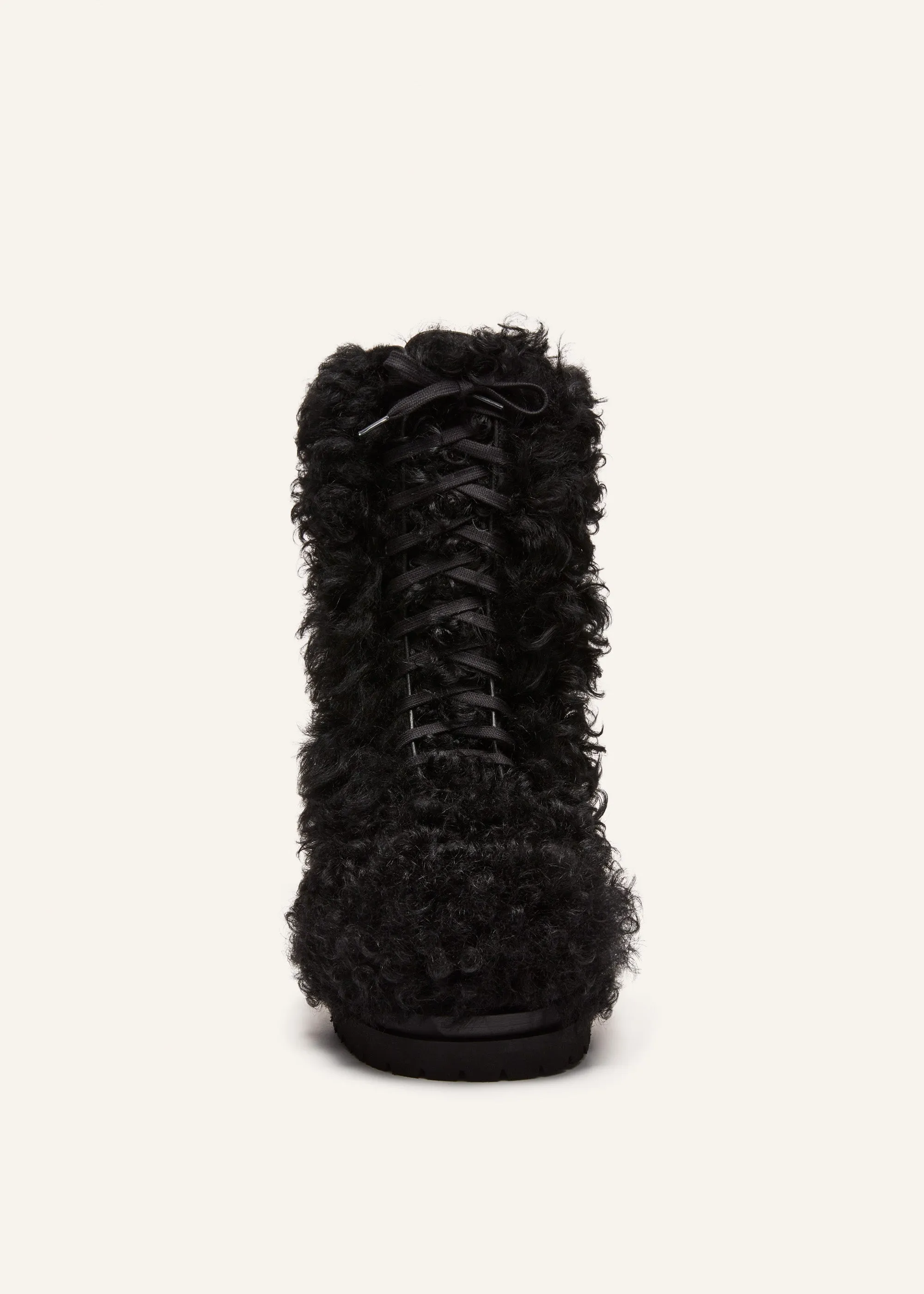 Shearling combat boots in black